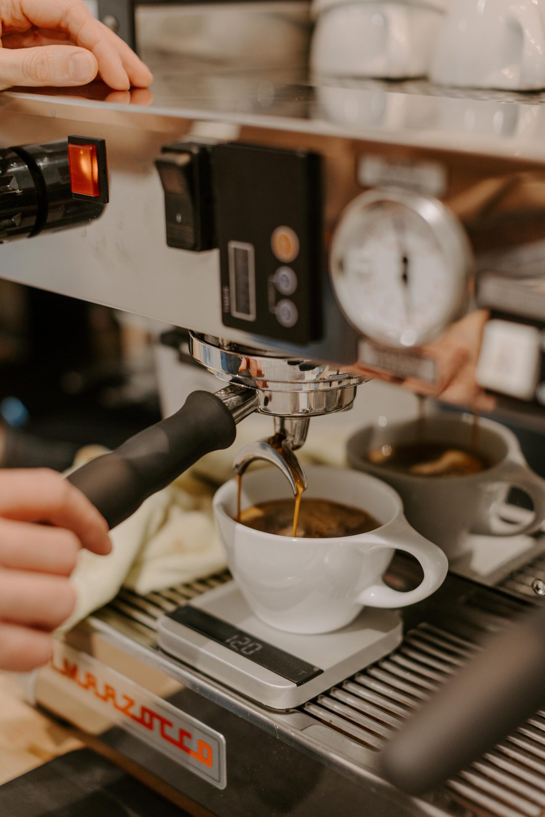 Dialing in a shot of espresso on the scale at The Cannon