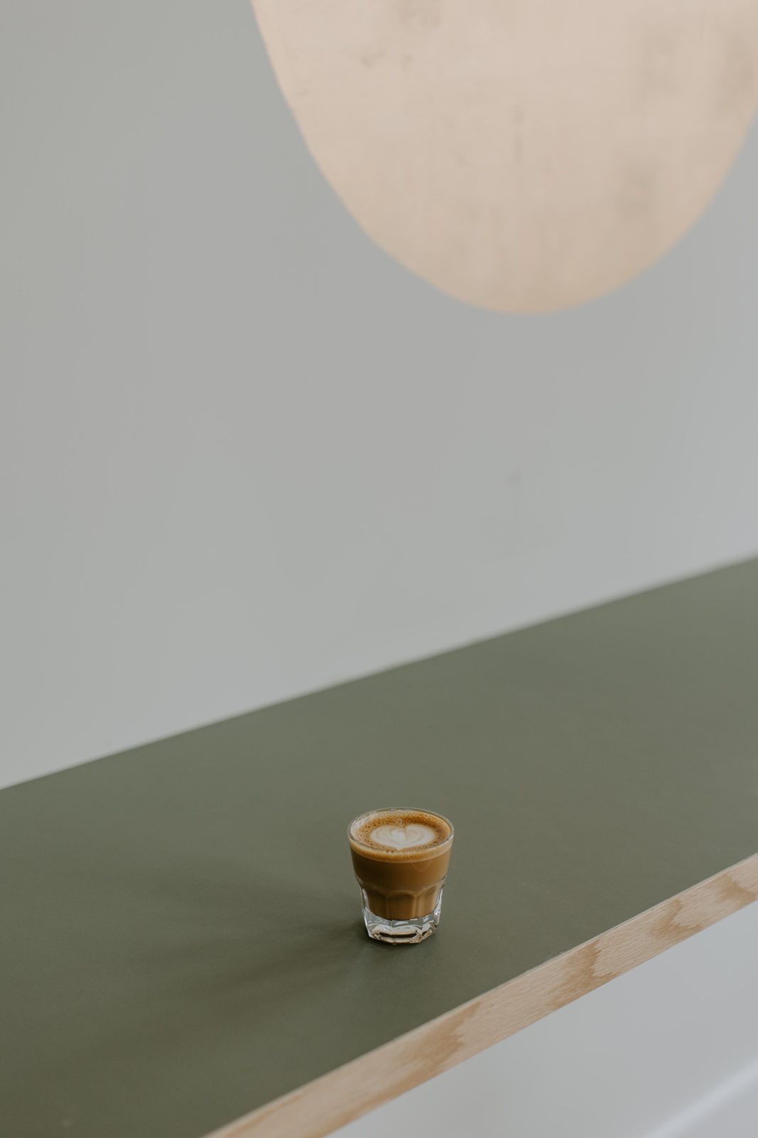 A cortado on the mint counter